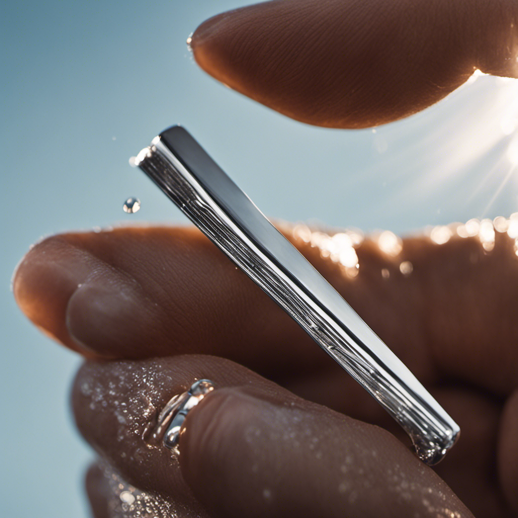 -up image of a person's hand holding a shiny silver razor, gliding effortlessly across a smooth scalp, while tiny droplets of water glisten in the sunlight, capturing the precise moment of achieving a perfectly bald head